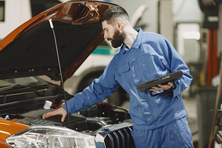 mechanic checking car engine mechanic checking car engine